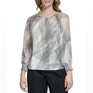 Calvin Klein women’s 
Line Printed 3/4 Smocked Sleeve Matte Jersey Blouse. M